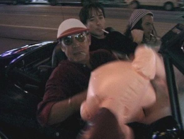 Hunter S. Thompson, John Cusack and Johnny Depp riding around with a blow-up doll.