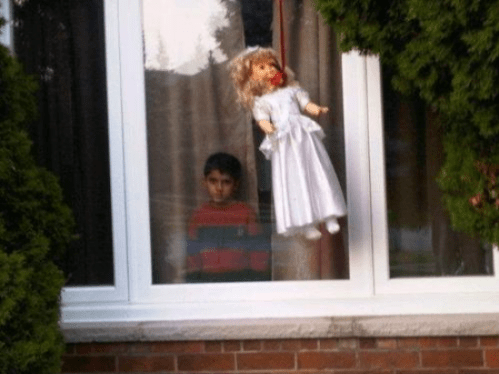 doll in window